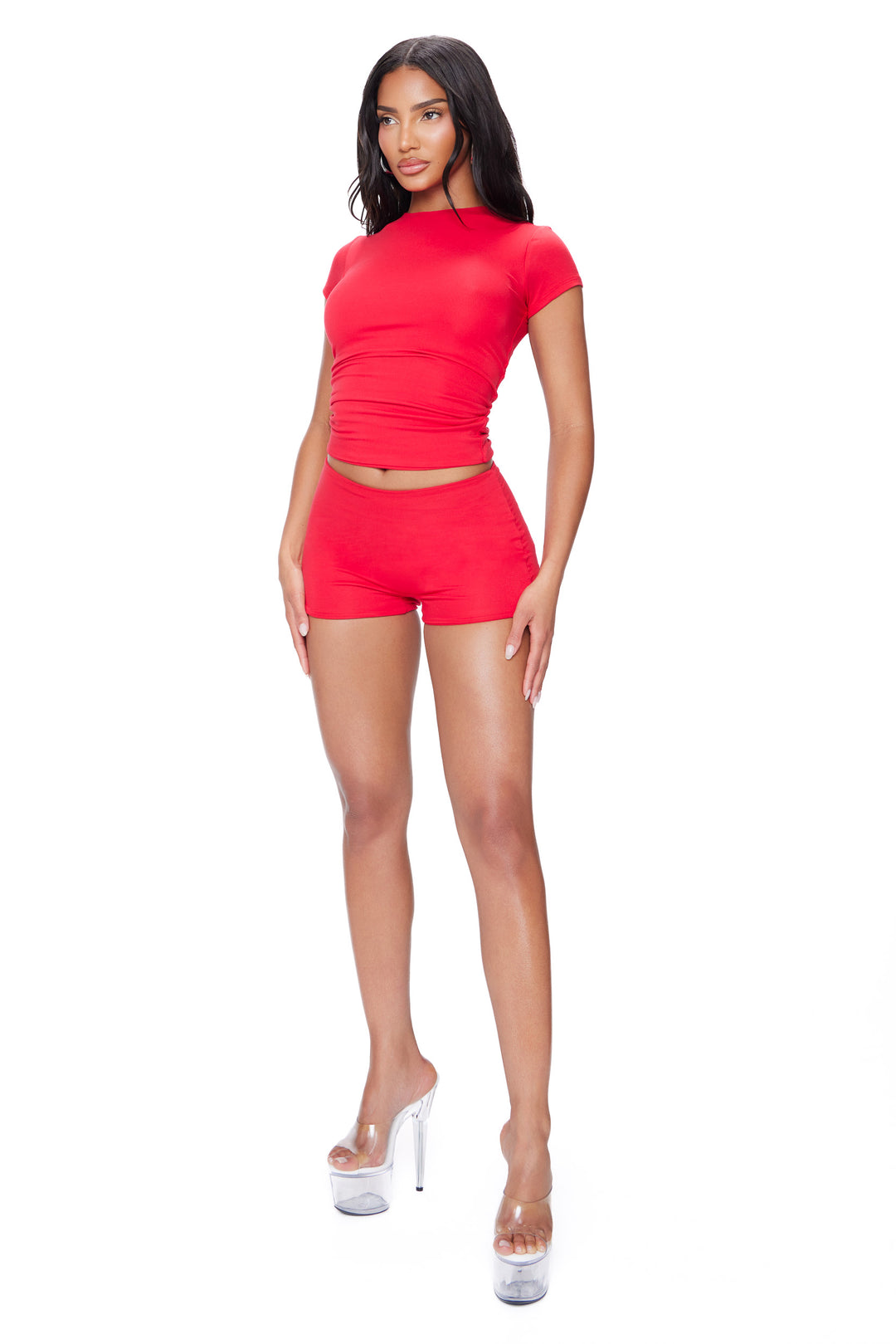 Woman wearing a red outfit on a white background